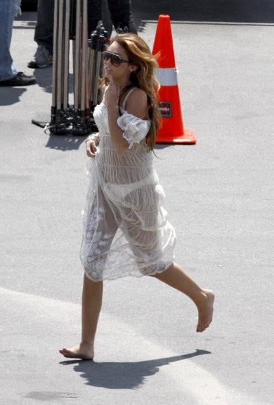 Miley Cyrus See Through Dress And Bikini Candids At Music