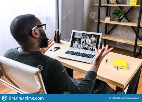 A Guy Talking Online With Employees Via Video Call Stock Image Image