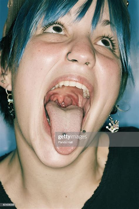 Punk Woman Sticking Out Tongue Portrait Foto De Stock Getty Images