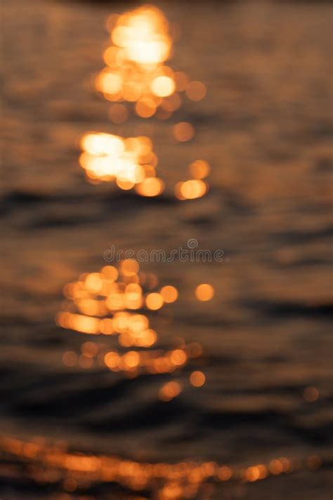 Blurred Ripple Sea Ocean Water Surface With Golden Sunset Light Blurry