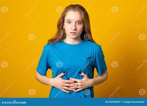 Young Girl Holding Her Stomach And Frowns Woman Has A Stomach Ache