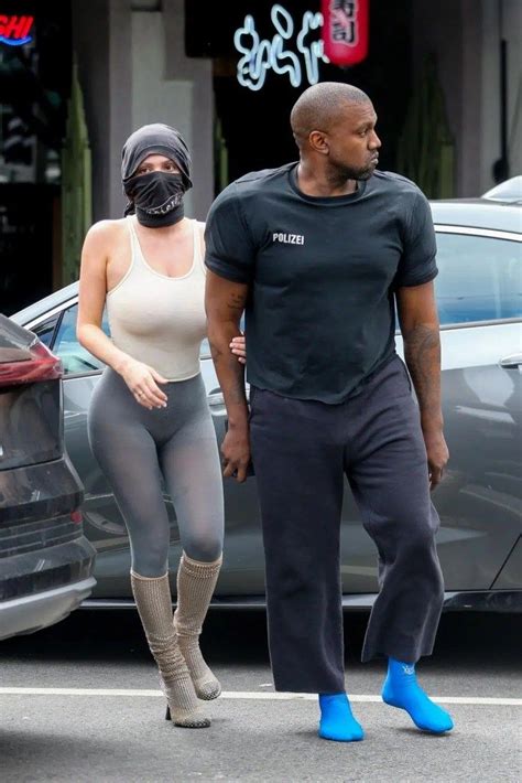 Kanye West Dresses In Big Shoulder Pads And Sock Sneakers In