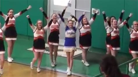 Watch Squad Joins Cheerleader From Opposing School Who Was Cheering