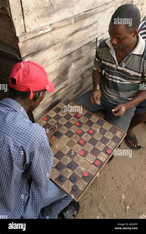 African Men Playing Checkers Locally Known At Draft In Ghana West