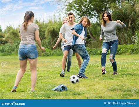 Teenagers Playing Football In Park Stock Image Image Of Group