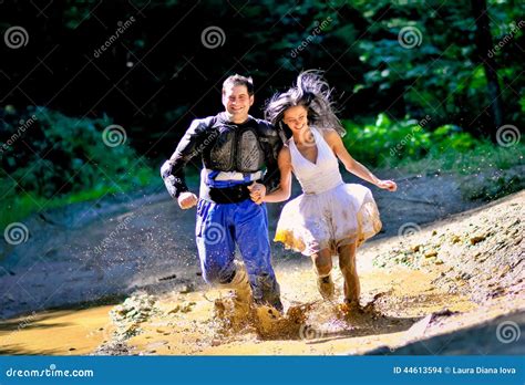 Couple Running Through The Mud Stock Photo Image Of Married Motor