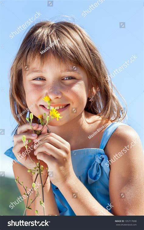 Happy Little Girl Smelling Flowers His Stock Photo 195717008 Shutterstock