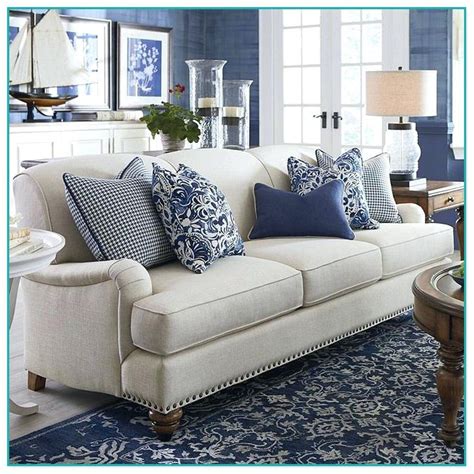 Elegant Cream Sofa With Navy Blue Cushions