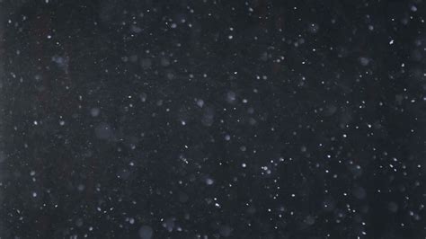 Real Falling Snow On A Black Background For Use As A Texture Layer In