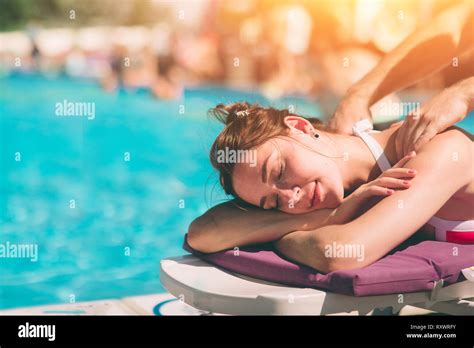 Spa Massage And Healthy Woman Enjoying Relaxing Body Massage Treatment Outdoors At Beauty Salon
