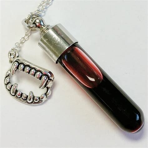 Gemstone Or Vial Of Blood Necklace With Fang Charm