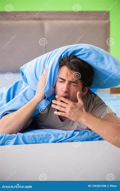 The Man Suffering From Sleeping Disorder And Insomnia Stock Photo