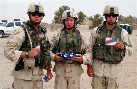 4th Infantry Division Soldiers Near Bayji Iraq Hold Pocket Flags They