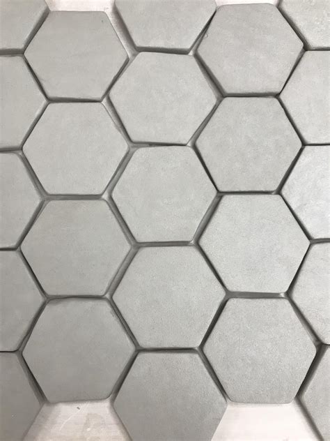 Making 100 of these handmade tiles. : Pottery