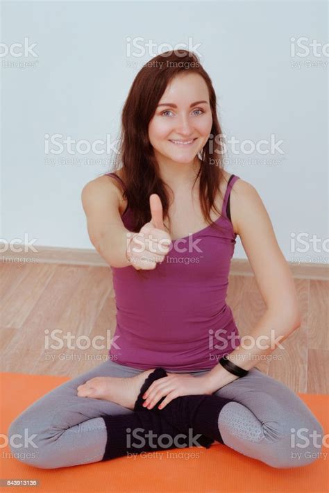 Smiling Girl Shows His Thumbs Up Look At Camera Closeup Portrait Of Girls After Yoga Practice