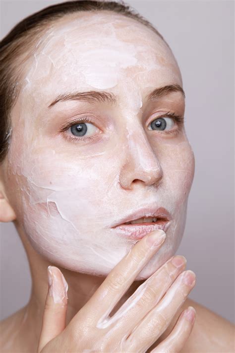 Free Images Young Female Woman Applying Facial Beauty Cream