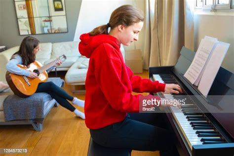 Teenage Girl Playing Piano Photos And Premium High Res Pictures Getty