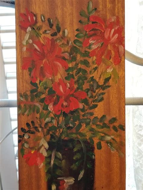 A Painting Of Red Flowers In A Brown Vase
