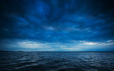 Blue Clouds Over Dark Blue Sea Hd Wallpaper Background Image 1920x1200