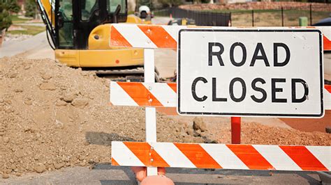 Road Closed Sign And Tractor Road Construction Stock Photo Download