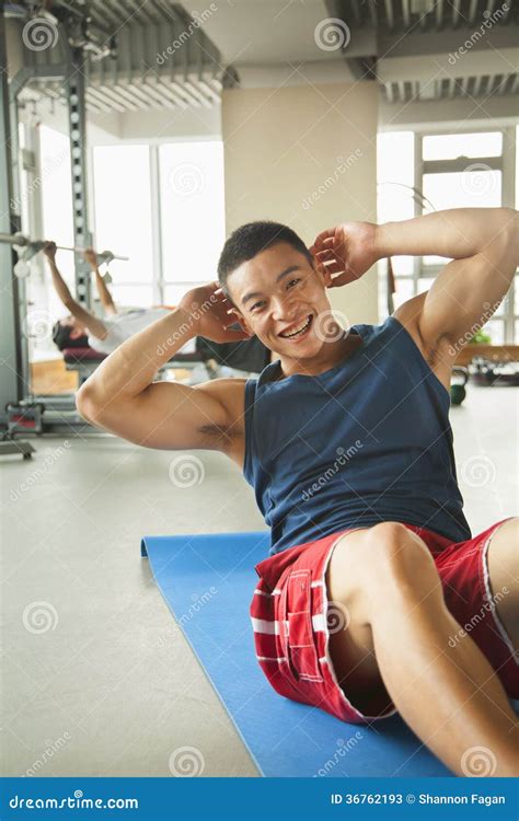 Young Man Doing Sit Ups In The Gym Stock Image Image Of Looking