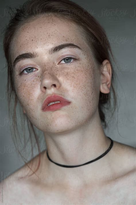 Face Of A Beautiful Girl With Freckles Close-up by Andrei Aleshyn