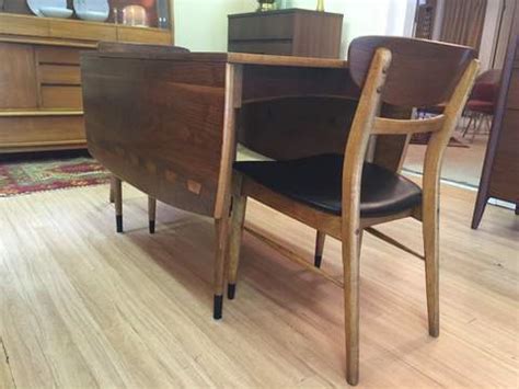 Oak frames with walnut backs showing acclaim collection signature oak inlay bowtie motif. Mid-Century Lane Acclaim Drop Leaf Table & Six Chairs - EPOCH