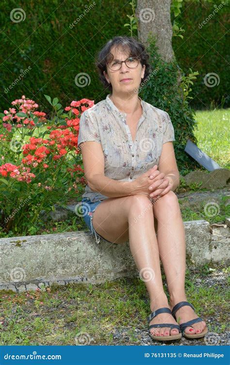Mature Woman Sitting In Garden Stock Image Image Of Garden Happiness
