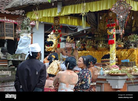 A Balinese Hindu Priest Gives Blessing To A Bride In A Traditional