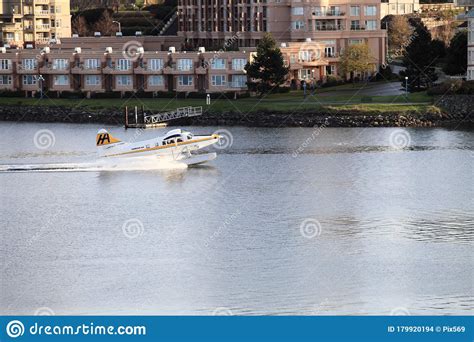 A Sightseeing Float Plane Landing On Victoria Harbor Stock Photo