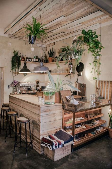 Beautiful And Warm Coffee Shop Interior With Plants Cafe Interior