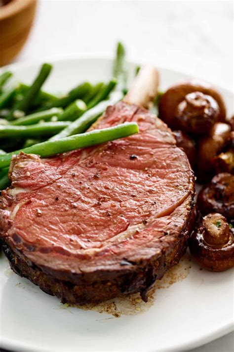 Pour back into roasting pan or large saucepan and return to heat. Prime Rib with garlic butter served with green beans and ...