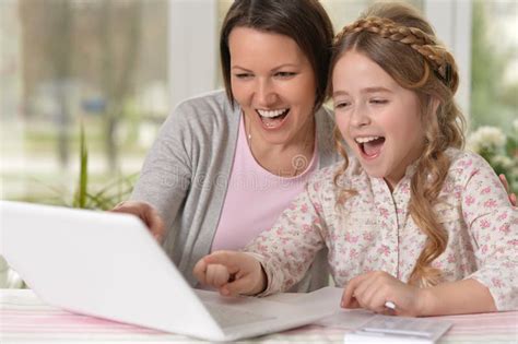 Mother And Daughter Using Laptop Stock Photo Image Of Help Child