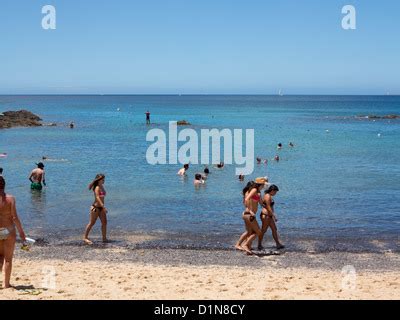 Girls Walking Along Playa De Papagayo Beach Near Playa Blanca Stock