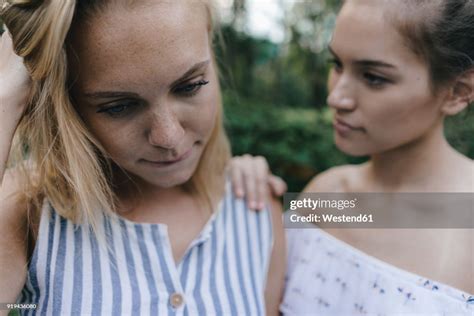 Young Woman Comforting Sad Female Friend Photo Getty Images