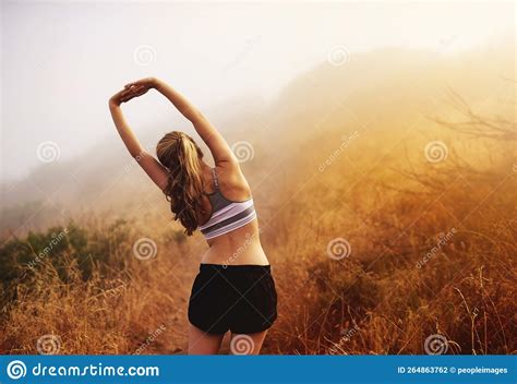 Stretching Is Essential Rear View Shot Of A Sporty Young Woman