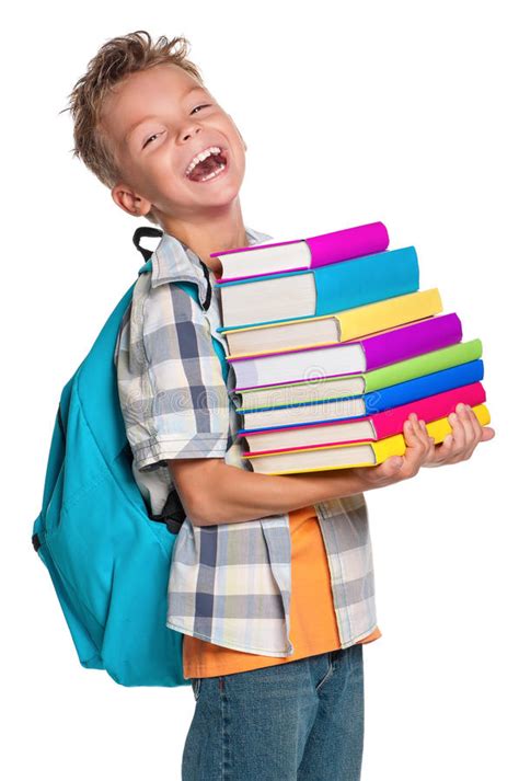 Happy Boy With Stack Of Books In A Classroom Stock Image Image Of