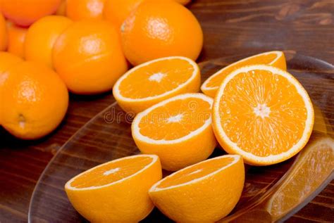 Sliced Ripe Appetizing Delicious Orange On Brown Table Stock Image