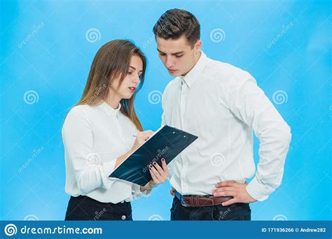 Concentrated Business People Working With Papers Standing Over Blue