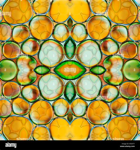 Kaleidoscopic Pattern Of Oil Drops On Water Stock Photo Alamy