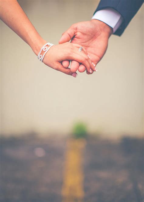 Photo Of Man And Woman Holding Hands · Free Stock Photo