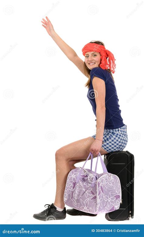 A Beautiful Tourist Woman With Baggage Showing Sign Isolated On Stock