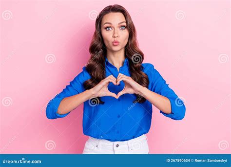 Photo Of Satisfied Lady Pouted Lips Kiss Showing Love Symbol Wear Blue Shirt Curly Hair