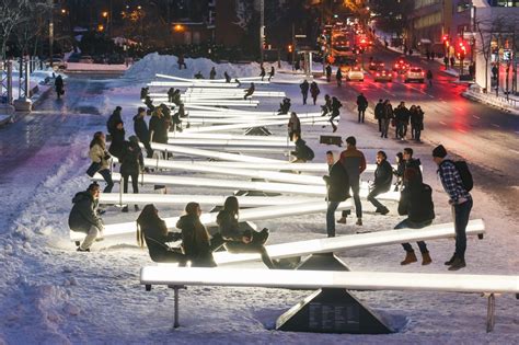 illuminated oversized seesaws transform new york city s garment district into an winter wonderland