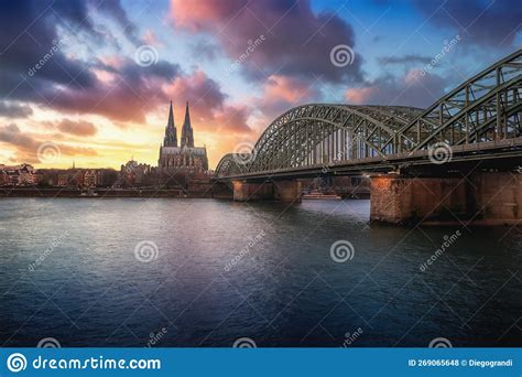 Cologne Skyline With Cathedral And Hohenzollern Bridge At Sunset