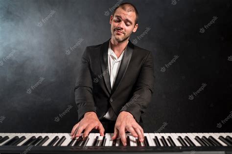 Free Photo Front View Passionate Musician Playing Chords On Piano