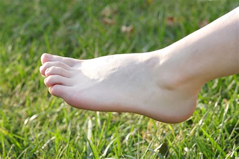 Beautiful Women S Jade Feet On The Grass Background Foot Jade Foot