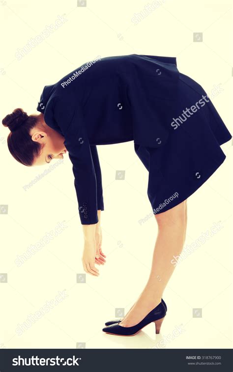 Young Business Woman Bending Down Looking Stock Photo 318767900
