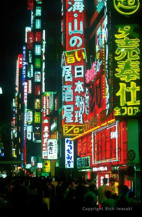 Neon Signage And City Street Scene At Night In The Ginza District