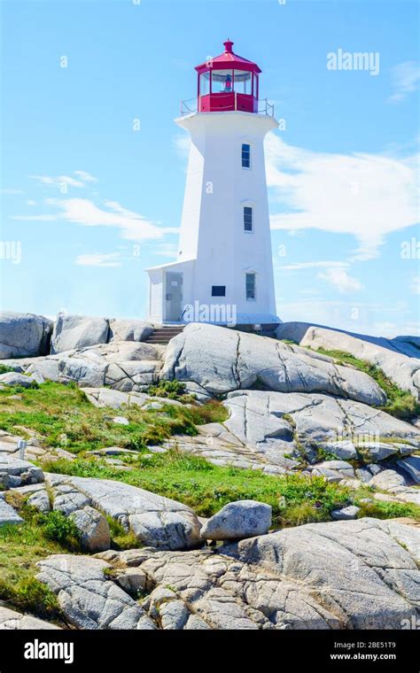 View Of The Lighthouse Of The Fishing Village Peggys Cove In Nova